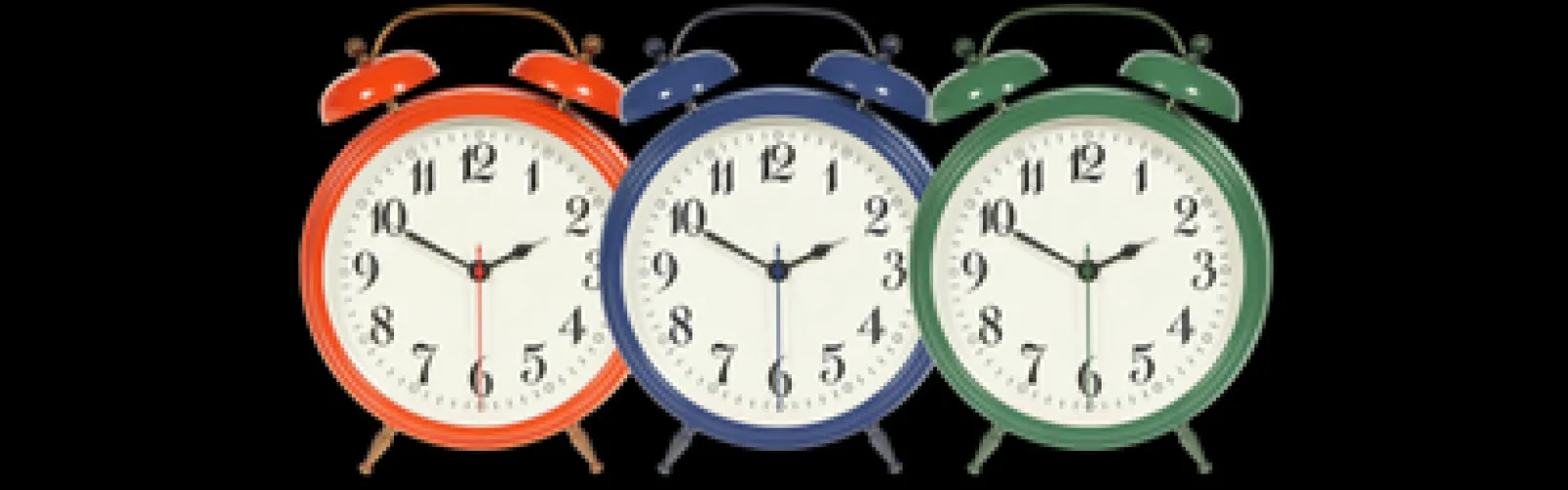 Three clocks in a row in different colors