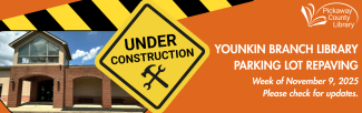 orange background with construction signs and photograph of library