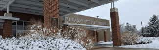 snowy landscaping and brick building with Pickaway County Library sign